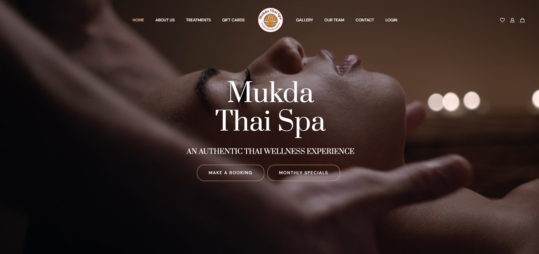 Mukda Thai Spa logo and serene image of a person receiving a head massage